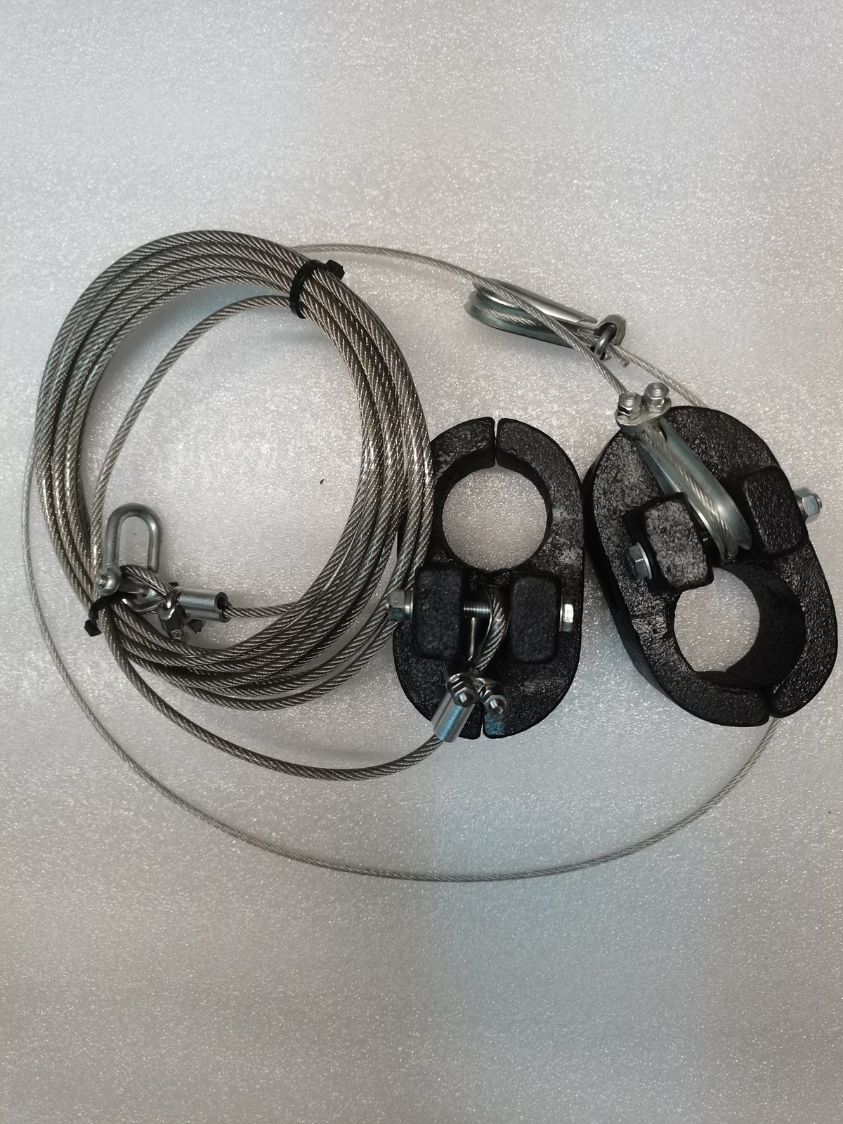 Coiled wire rope with sheaves and a terminal switch