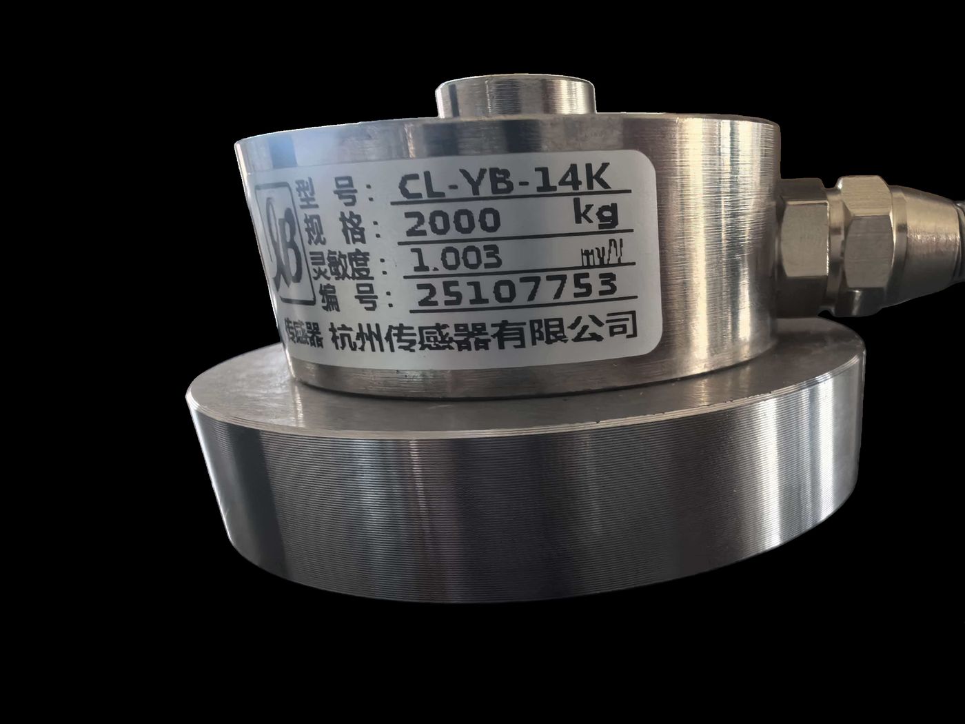 Stainless spoke-type cell on black, nameplate marking a 2000 kg range, 1.003 mV/V output and a serial number