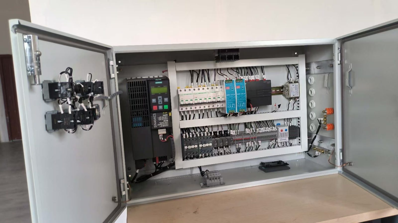 Open enclosure showing breakers, relays and the collector terminal strip