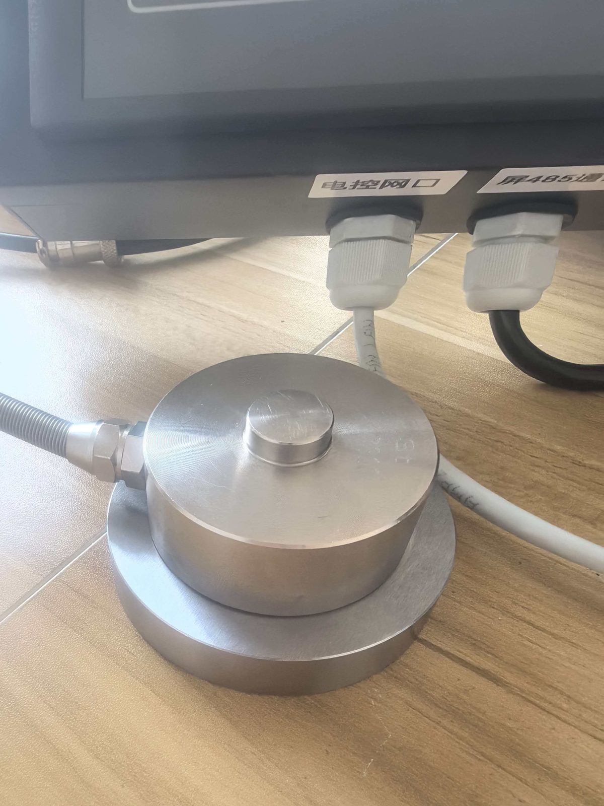 Pancake compression load cell with cable beside a terminal