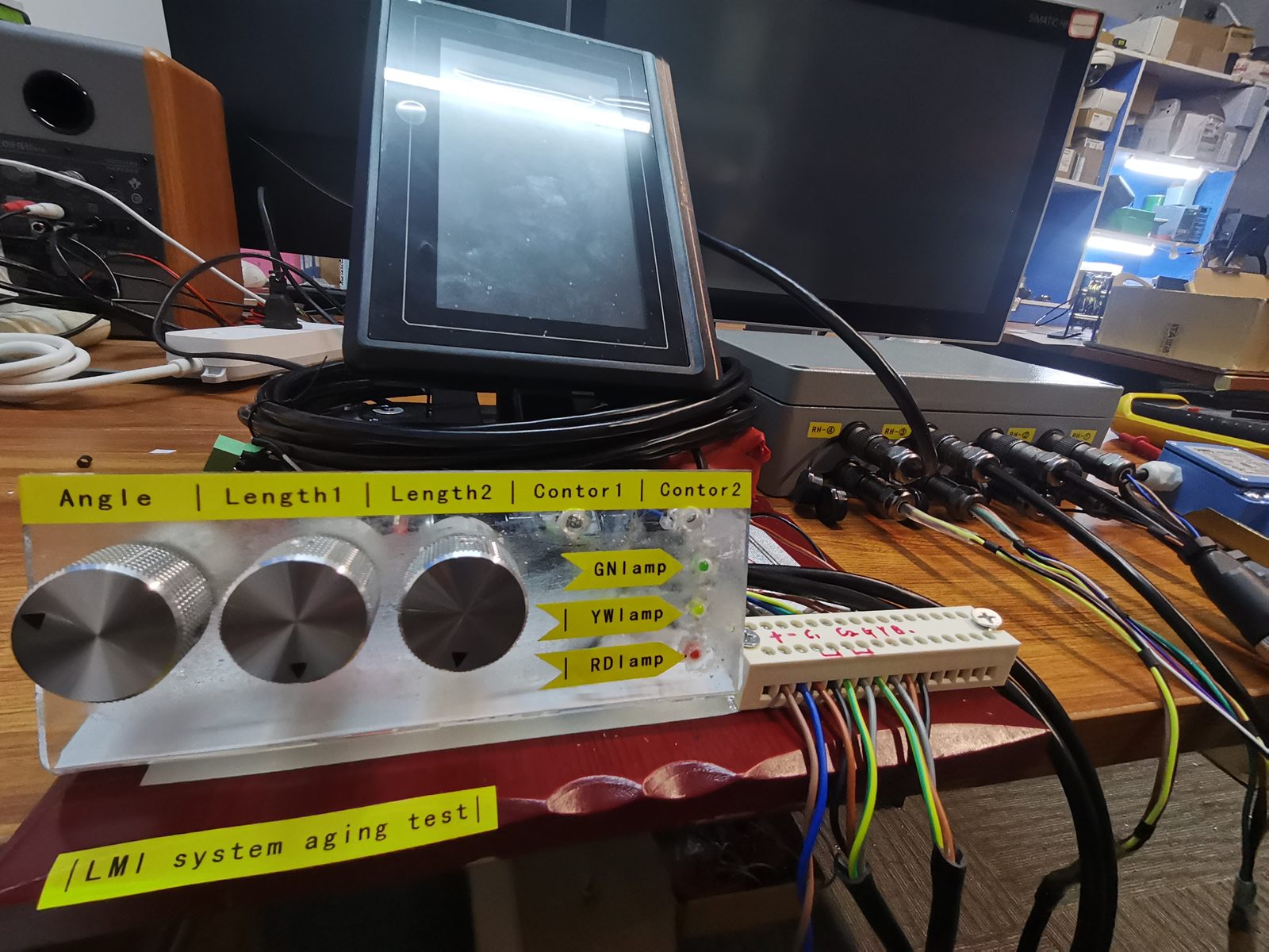 Ageing test panel with three encoder knobs and labelled channel strips