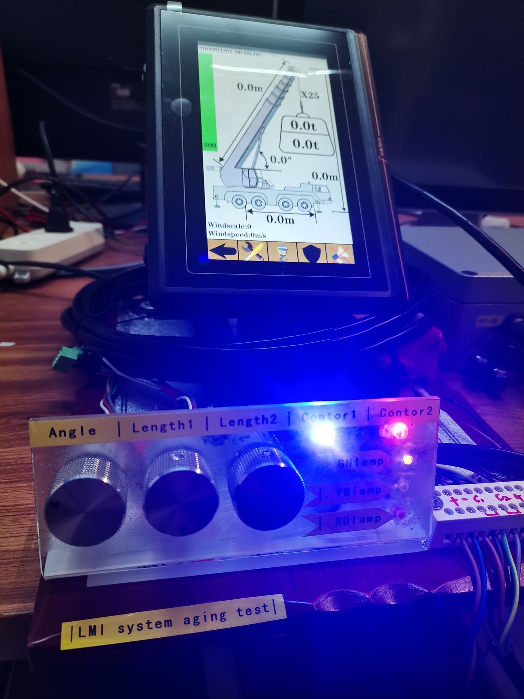 Terminal standing on a clear ageing rig labelled by channel with three knobs and an indicator lit
