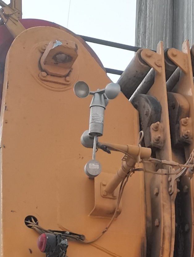Cup anemometer head on a weathered bracket