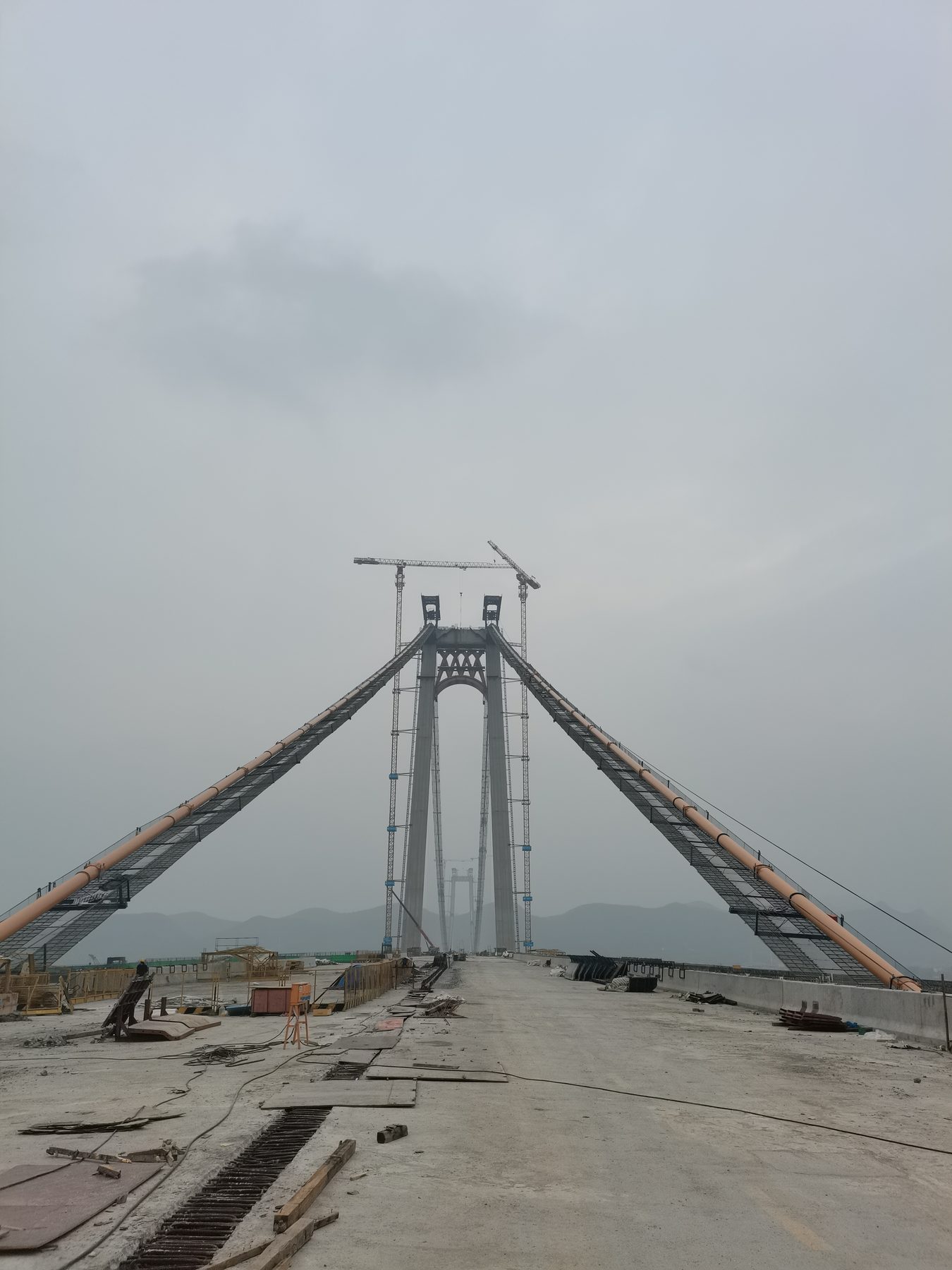 Bridge structure under an overcast sky at a construction site