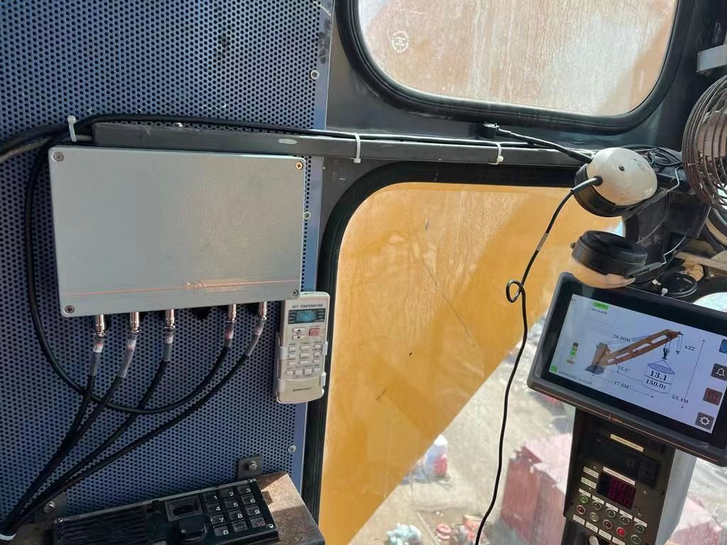 Load moment terminal mounted beside the controls inside a crane cab