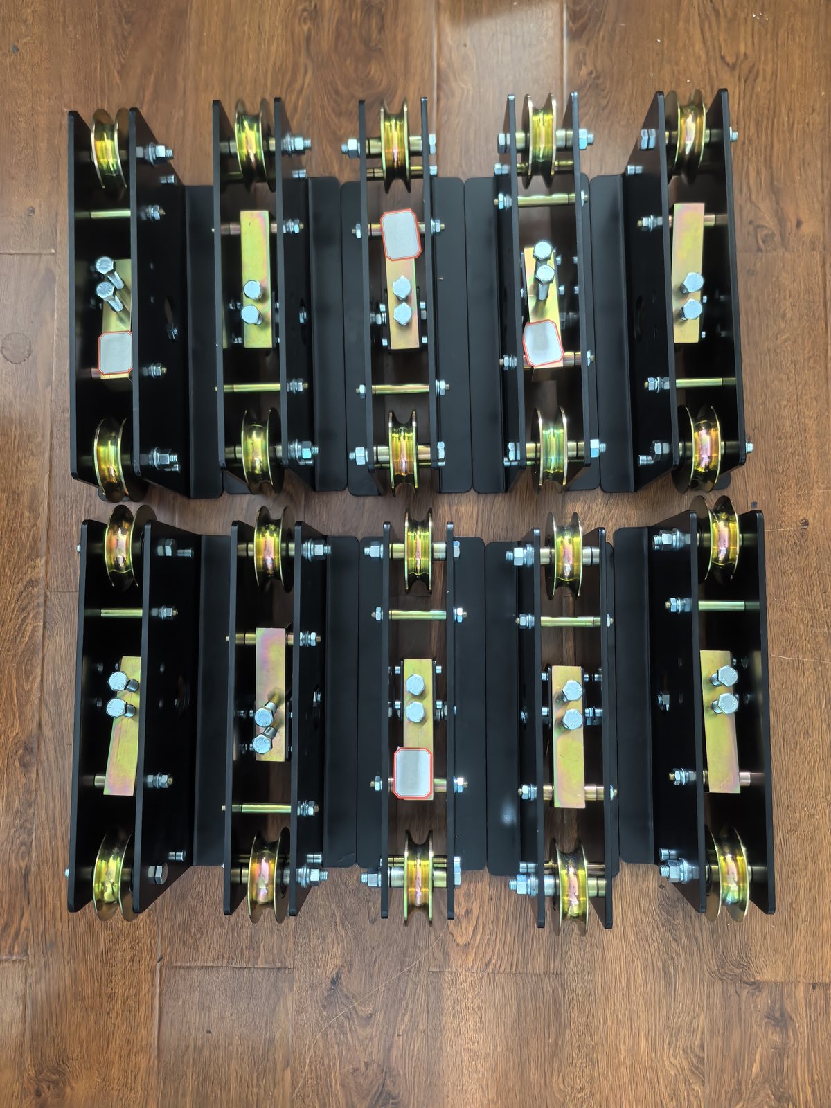 Three-sheave assemblies lined up in rows on the works floor